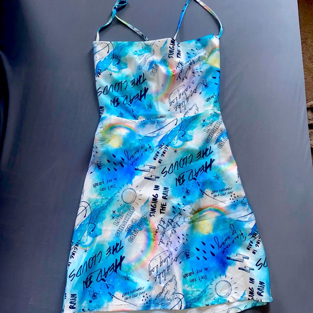 Mini dress with criss cross tie. Never worn tag still on!